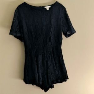 Skater romper with lace overlay.
